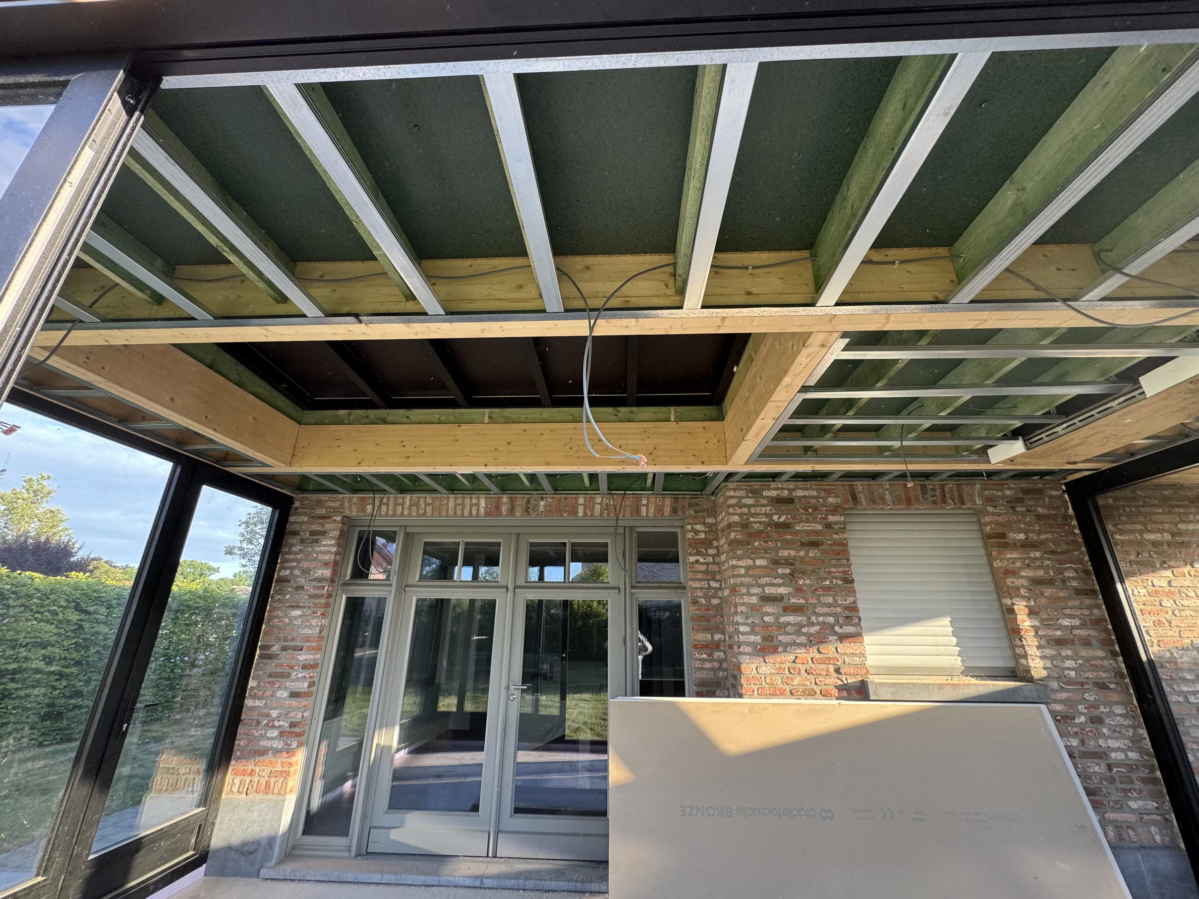 Renovation site with drywall and ladders